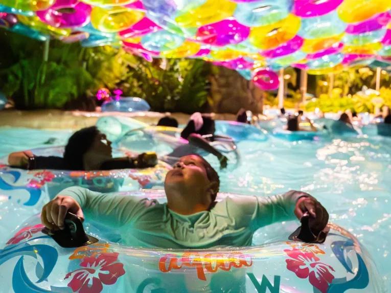 Boy at AquaGlow pool party at Aquatica Orlando