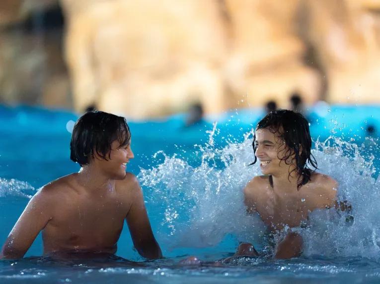 Guests at AquaGlow pool party at Aquatica Orlando
