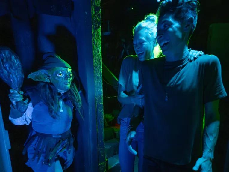 Guests in scare house at Universal Orlando Halloween Horror Nights