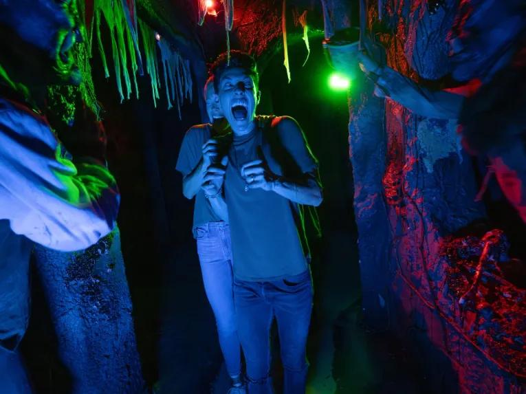 Guest in scare house at Universal Orlando Halloween Horror Nights