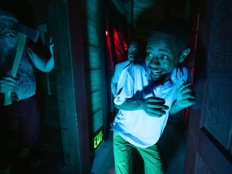 Guests in scare house at Universal Orlando Halloween Horror Nights