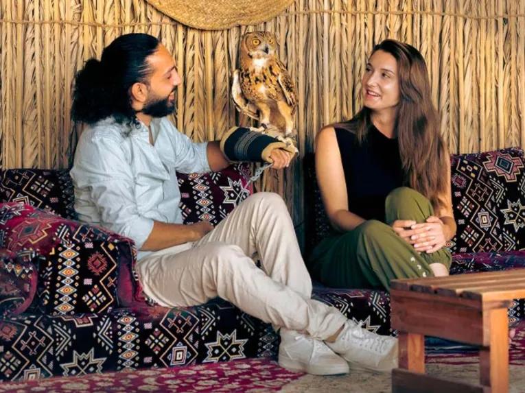 Man performing live traditional Emirati cooking during Bedouin Culture Safari