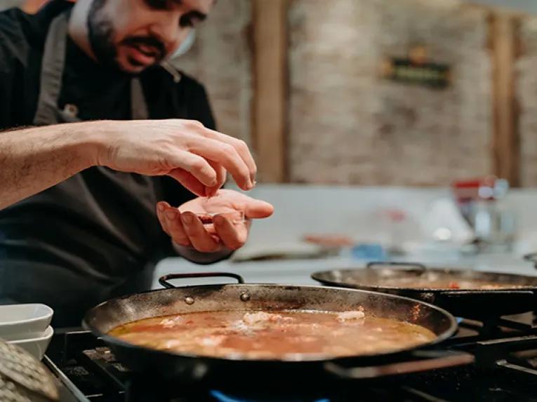Adding ingredients to a pan