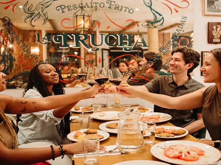 A group enjoying a Tapas meal