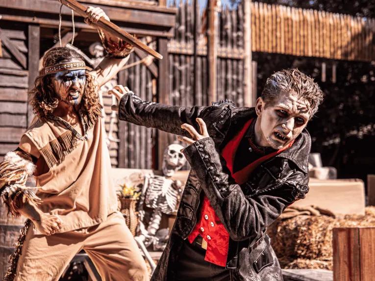 Performers in a wild west themed halloween show