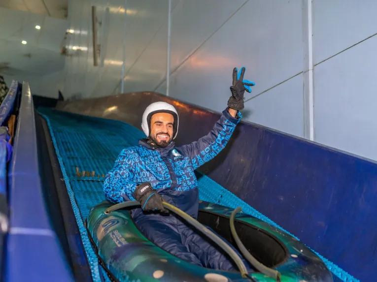 Guest enjoying the slide at Ski Dubai