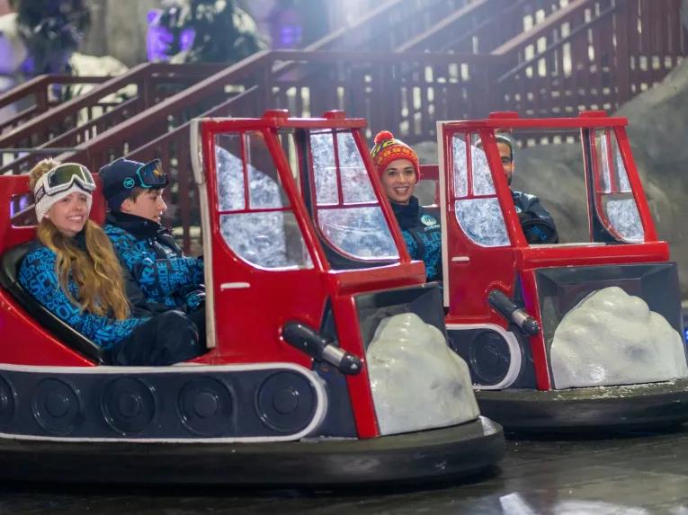 Guests enjoying the bumper cars at Ski Dubai