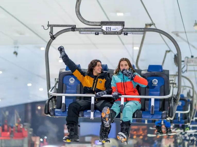 Guests enjoying the chairlift at Ski Dubai