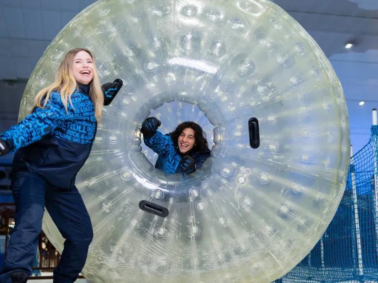 Guests enjoying the Zorb Ball at Ski Dubai