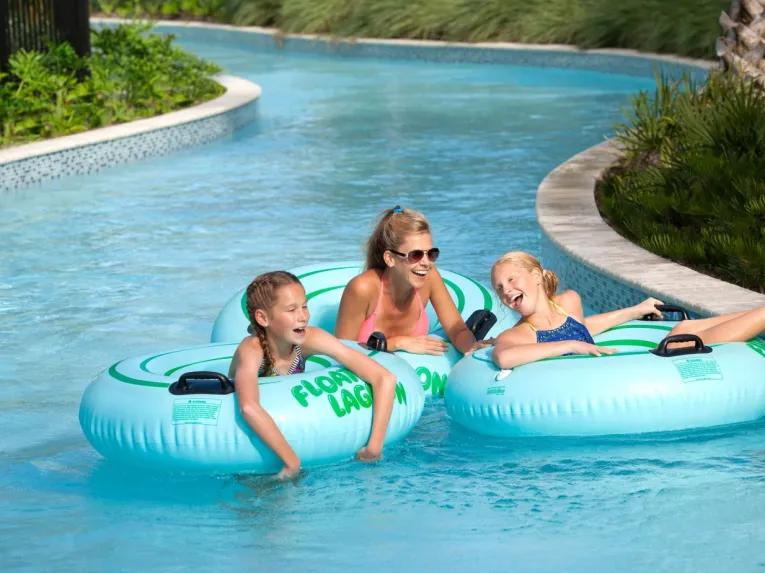 Family on the lazy river at the Hilton Orlando Buena Vista Palace Disney Springs® Area