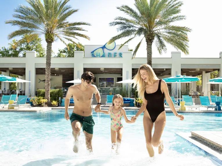 Family enjoying the pool at the Hilton Orlando Buena Vista Palace Disney Springs® Area