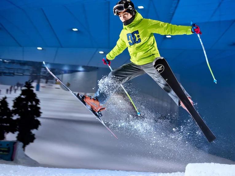 Skier airborne during a jump on the indoor ski slope at Ski Dubai, Dubai