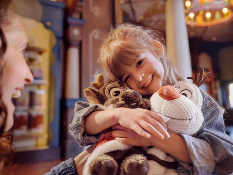 Child with Olaf & Sven plus at World of Frozen