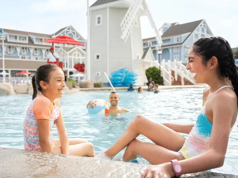 Guests enjoying the pool at Disney’s Yacht and Beach Club Resort