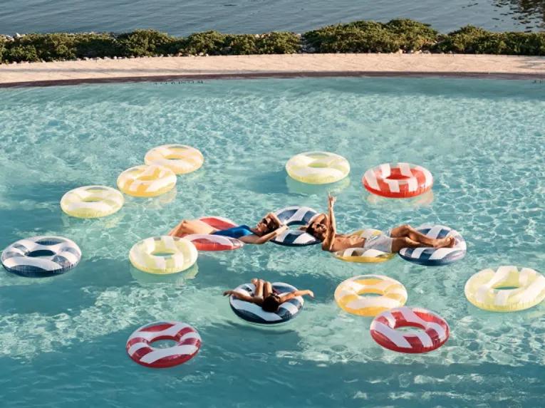 Guests relaxing in the pool at the Four Seasons Orlando