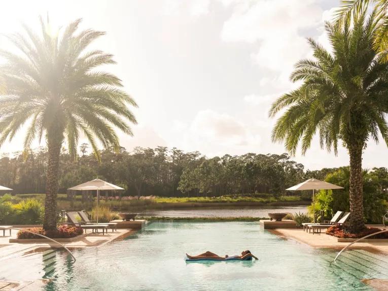 Guest relaxing in the pool at the Four Seasons Orlando