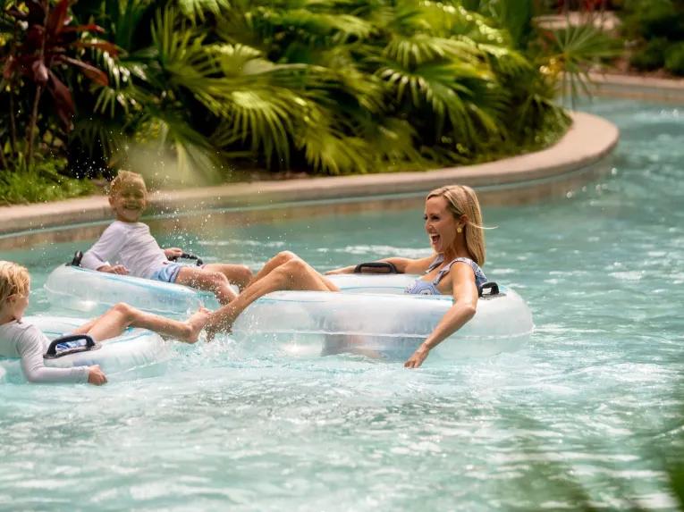 Guests riding the lazy river at the Four Seasons Orlando
