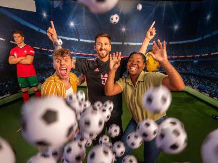 Guests with Messi at Madame Tussauds Orlando