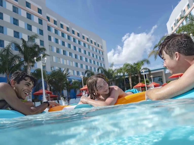 Kids floating on the pool at Universal's Endless Summer Resort – Surfside Inn and Suites