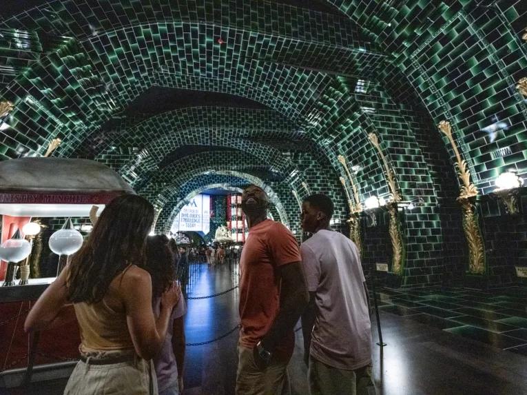 Guests inside The Wizarding World of Harry Potter™ - Ministry of Magic™ at Universal Epic Universe